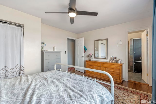 bedroom with wood finished floors and ceiling fan