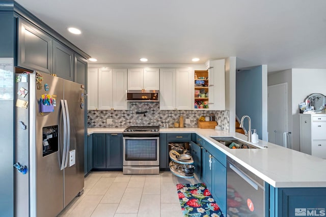 kitchen featuring a sink, range hood, a peninsula, stainless steel appliances, and open shelves