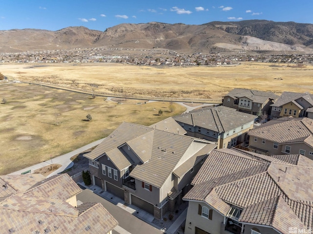 drone / aerial view featuring a mountain view