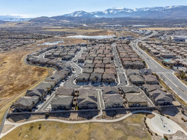 drone / aerial view with a residential view and a mountain view