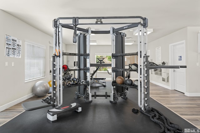 workout area featuring baseboards