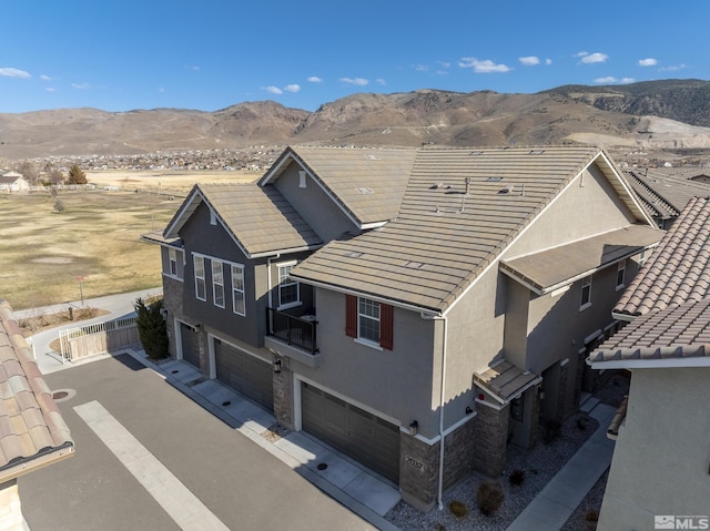 birds eye view of property featuring a mountain view