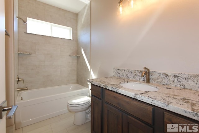 bathroom with tile patterned floors, bathing tub / shower combination, toilet, and vanity