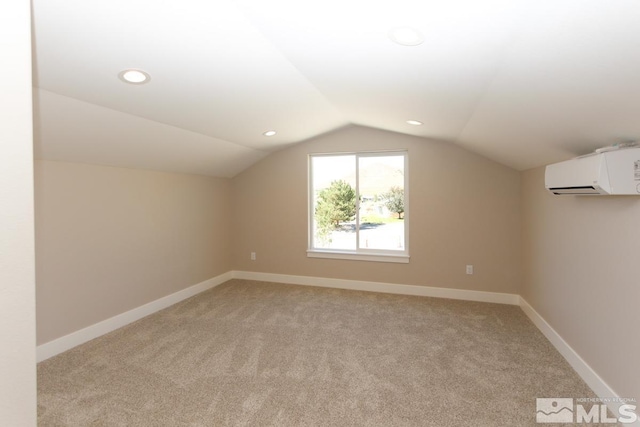 bonus room featuring an AC wall unit, recessed lighting, baseboards, light colored carpet, and vaulted ceiling