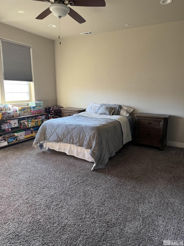 bedroom featuring visible vents, carpet floors, and ceiling fan