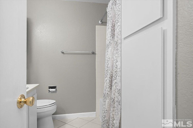 full bathroom featuring curtained shower, baseboards, toilet, and tile patterned flooring