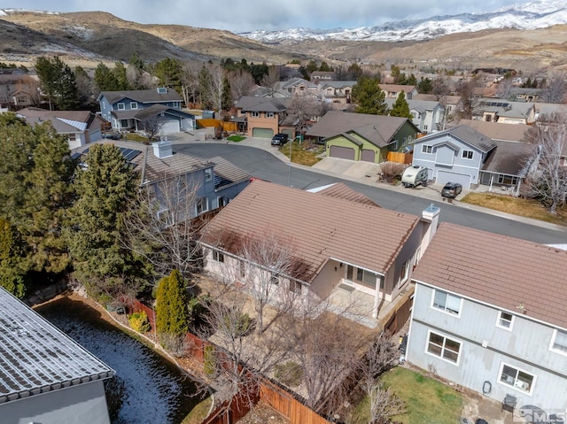 birds eye view of property with a mountain view and a residential view