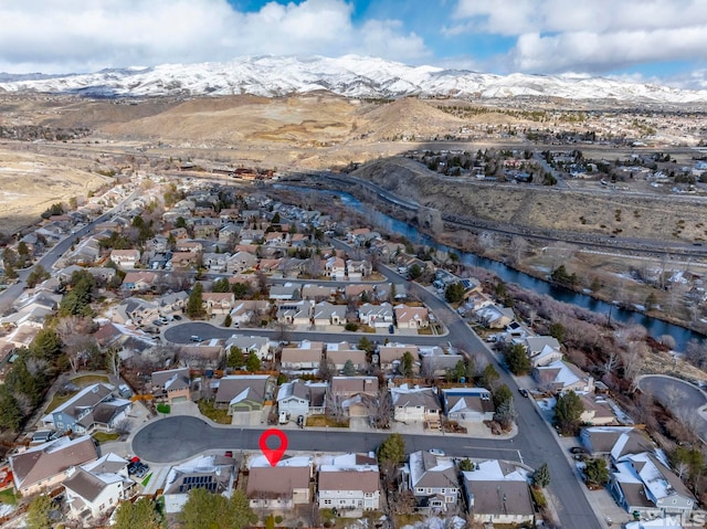 bird's eye view featuring a residential view and a water and mountain view