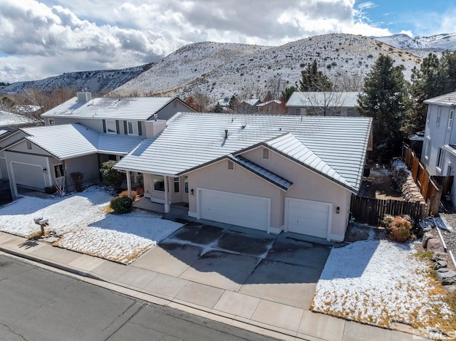 birds eye view of property featuring a mountain view