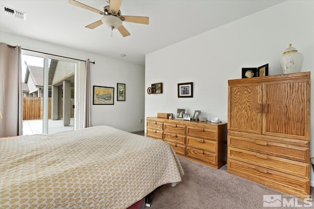 bedroom with visible vents, carpet, access to exterior, and a ceiling fan