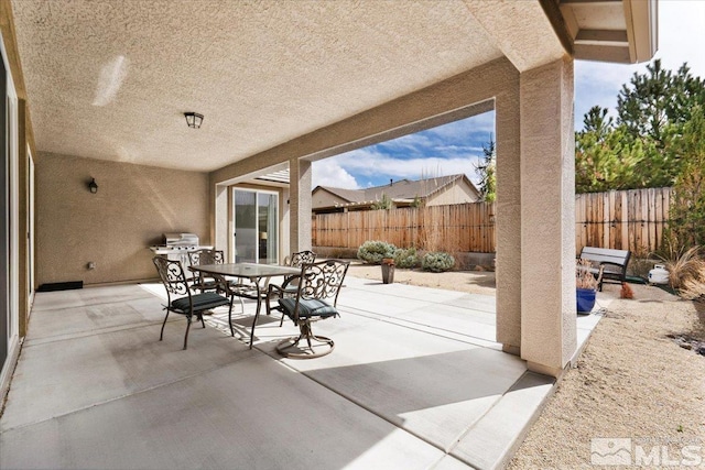 view of patio / terrace with a fenced backyard and outdoor dining space