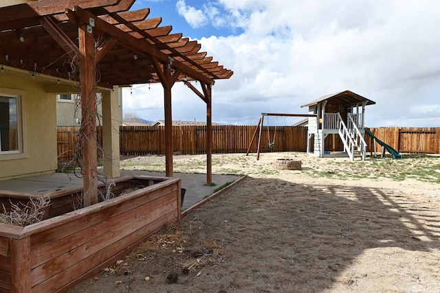 view of yard featuring a patio, a pergola, a playground, and a fenced backyard