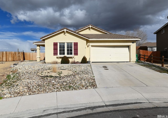 ranch-style house with stucco siding, driveway, an attached garage, and fence