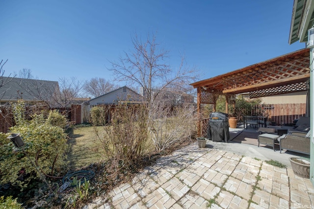 view of patio / terrace with area for grilling and a fenced backyard