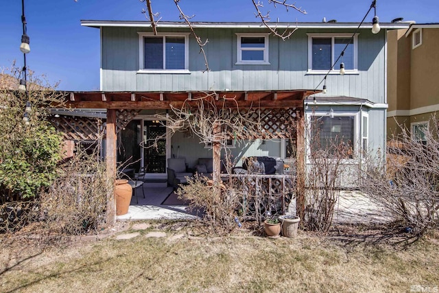 back of property with a patio