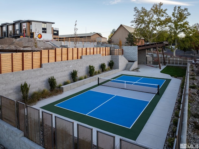 view of sport court with fence