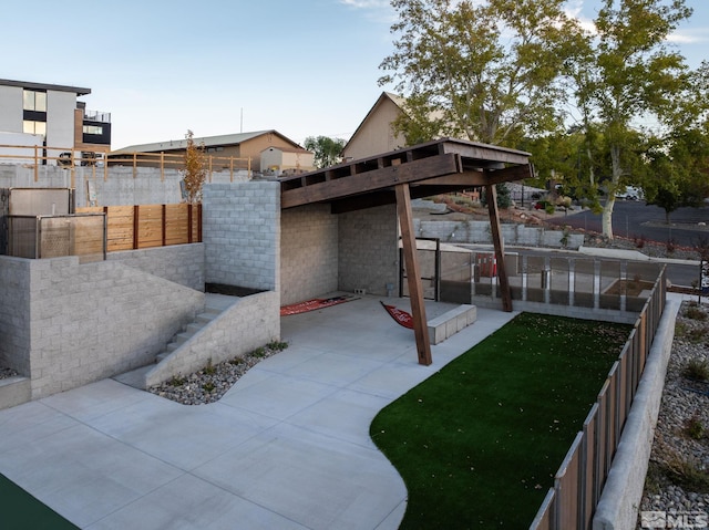 view of yard featuring a patio and fence