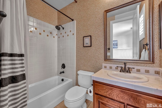 full bathroom featuring shower / bath combination with curtain, wallpapered walls, vanity, and toilet