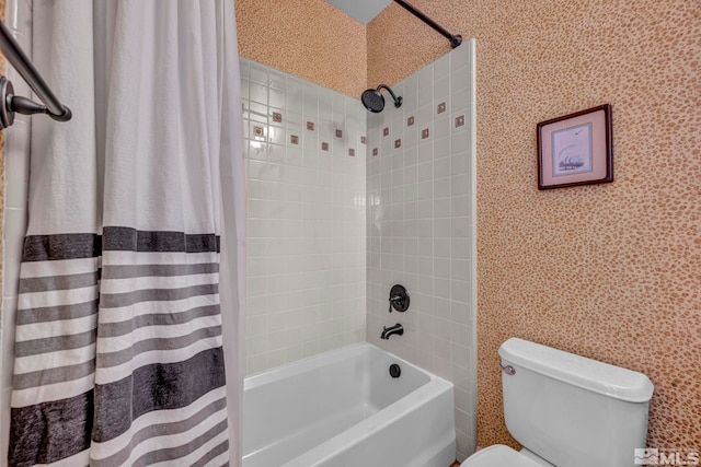 full bathroom with wallpapered walls, toilet, and shower / tub combo