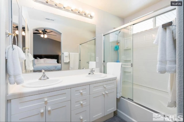 bathroom featuring a sink, connected bathroom, double vanity, and a ceiling fan