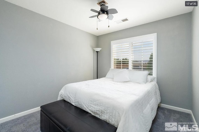 bedroom with carpet flooring, baseboards, visible vents, and a ceiling fan