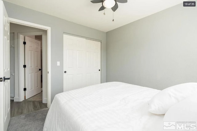 bedroom featuring a ceiling fan, a closet, and baseboards