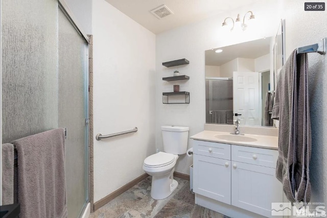 full bath featuring visible vents, a shower stall, baseboards, toilet, and vanity