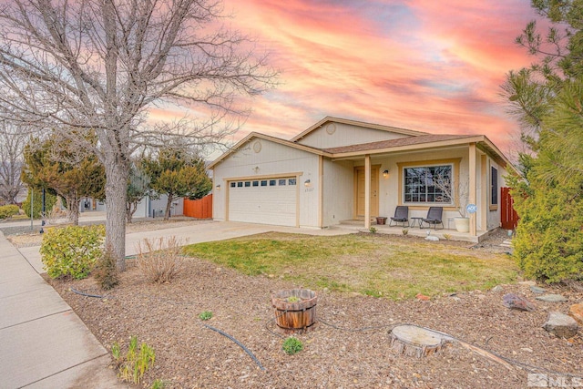 ranch-style home featuring an attached garage and concrete driveway