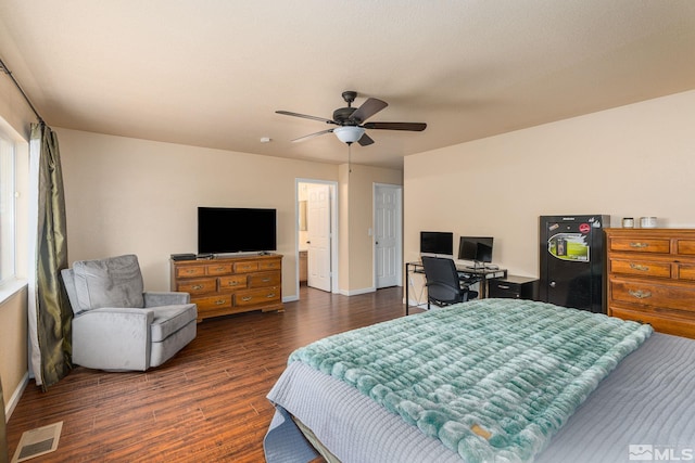 bedroom featuring a ceiling fan, baseboards, visible vents, dark wood finished floors, and freestanding refrigerator