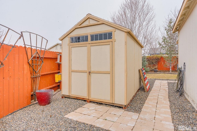 view of shed with a fenced backyard