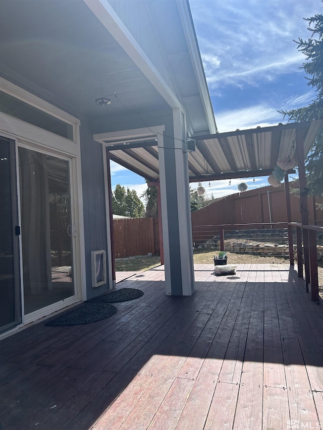 wooden deck featuring fence