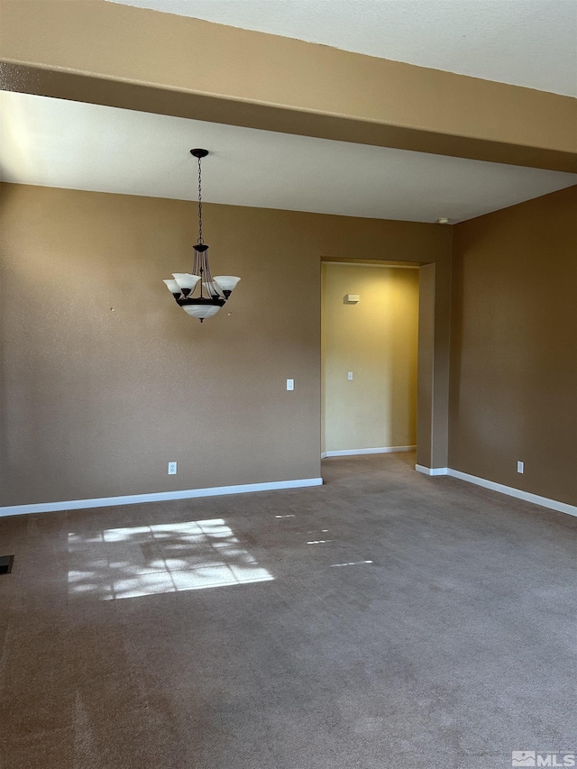 carpeted empty room with visible vents and baseboards