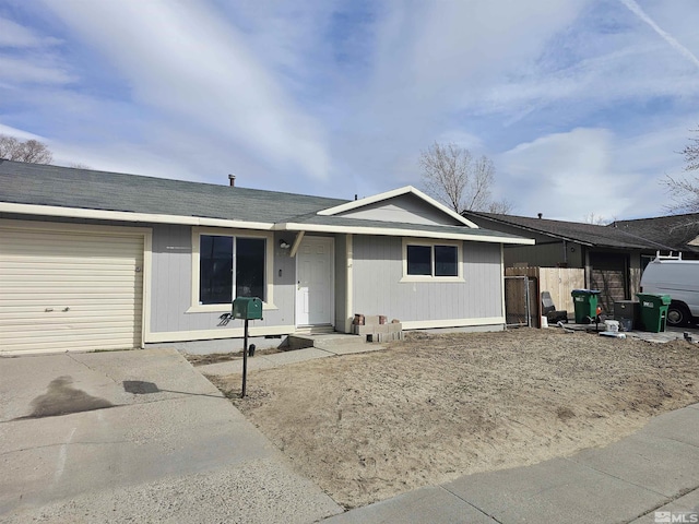 ranch-style home with concrete driveway