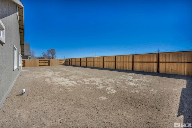 view of yard featuring a fenced backyard
