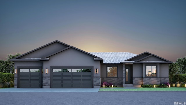 view of front facade featuring a garage, stone siding, driveway, and stucco siding