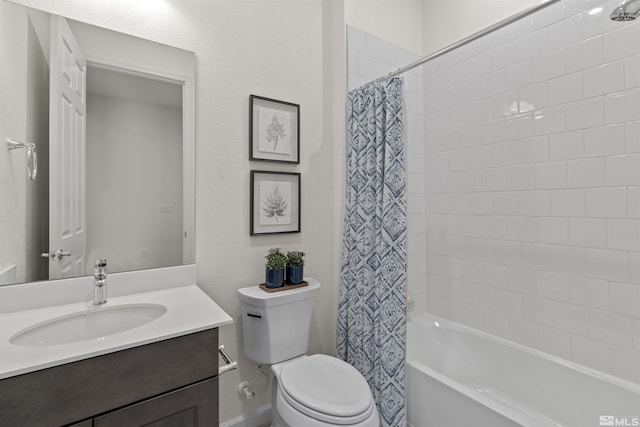 bathroom featuring vanity, toilet, and shower / bath combo with shower curtain