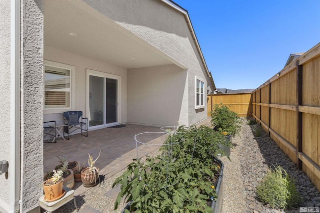 exterior space with a fenced backyard and a patio area