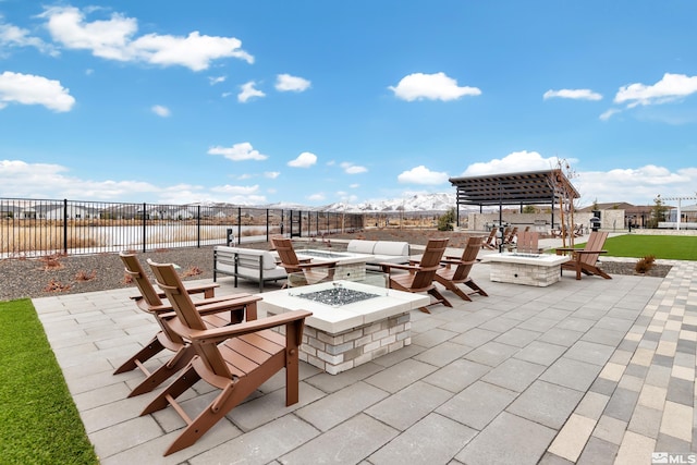 view of patio featuring fence and an outdoor fire pit