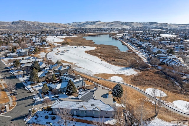 bird's eye view featuring a residential view and a water and mountain view