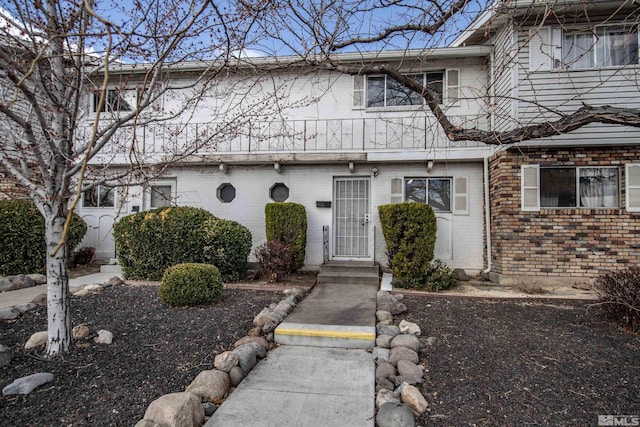 multi unit property featuring brick siding