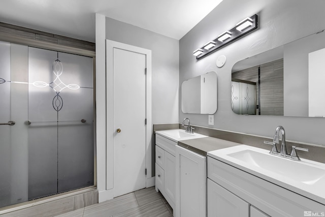 bathroom featuring a sink and double vanity