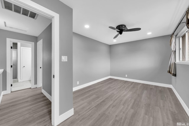 unfurnished room featuring visible vents, wood finished floors, recessed lighting, baseboards, and ceiling fan
