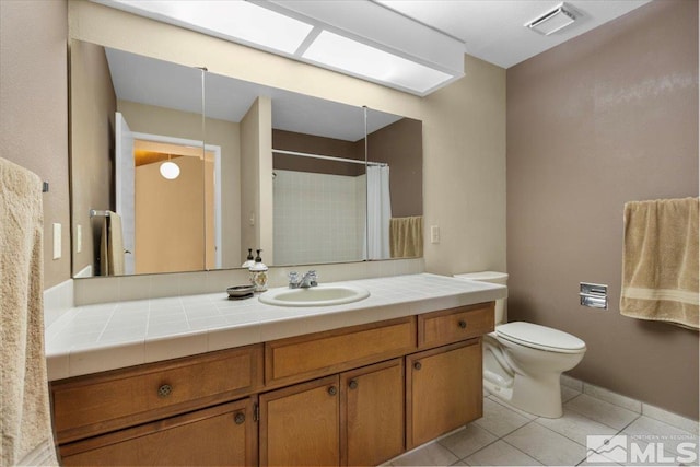 bathroom with tile patterned floors, visible vents, toilet, a shower with curtain, and vanity