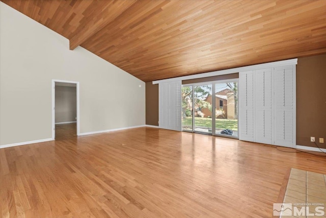 unfurnished living room featuring wood finished floors, baseboards, high vaulted ceiling, wooden ceiling, and beamed ceiling
