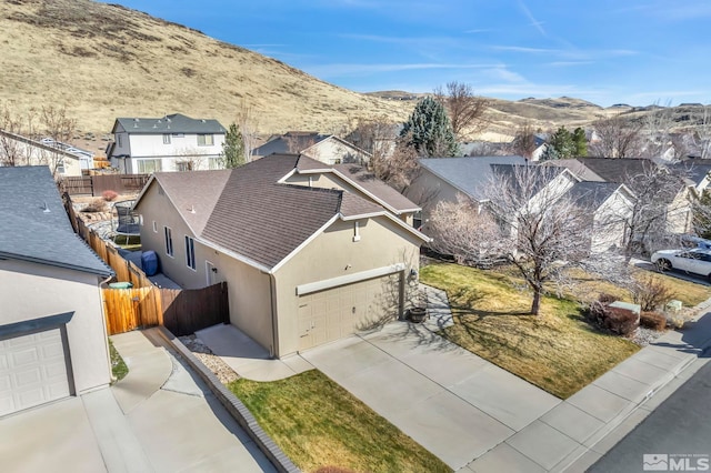 birds eye view of property featuring a mountain view and a residential view