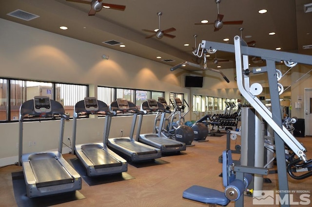 gym with recessed lighting, a ceiling fan, and visible vents