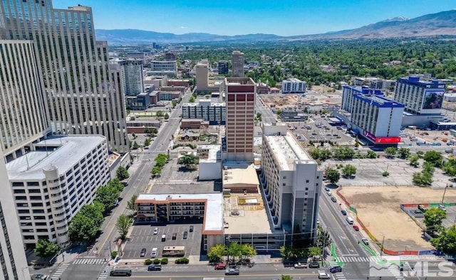 birds eye view of property with a mountain view and a view of city
