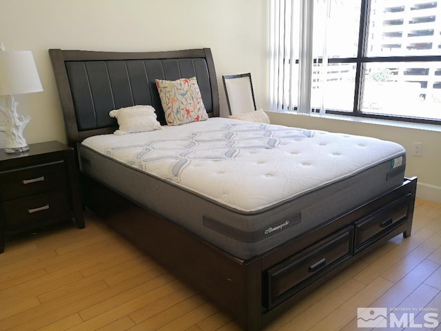bedroom with light wood-style floors