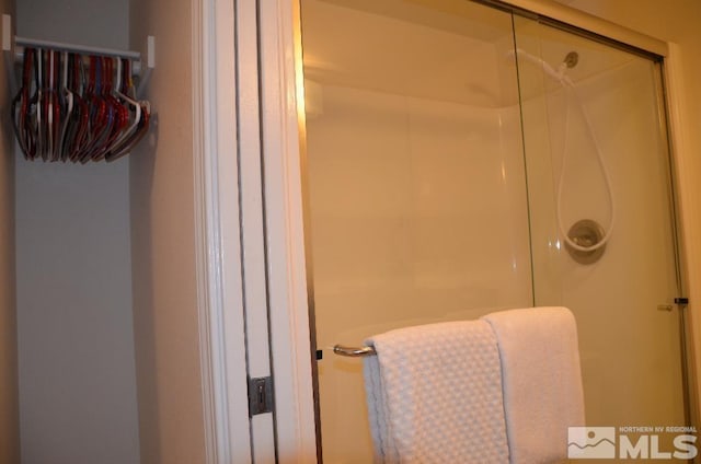 full bath featuring a shower stall
