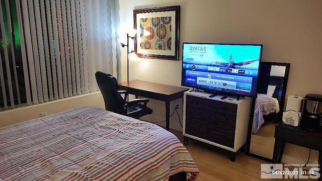 bedroom featuring wood finished floors